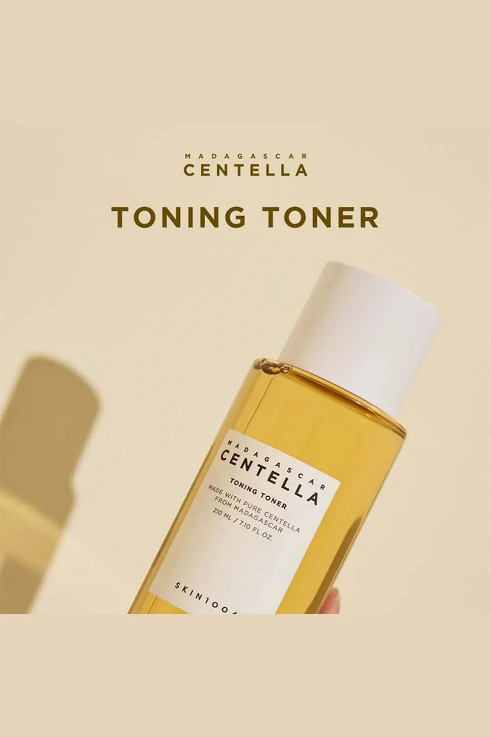 Bottle of Skinfood Madagascar Centella Toning Toner on a beige background
