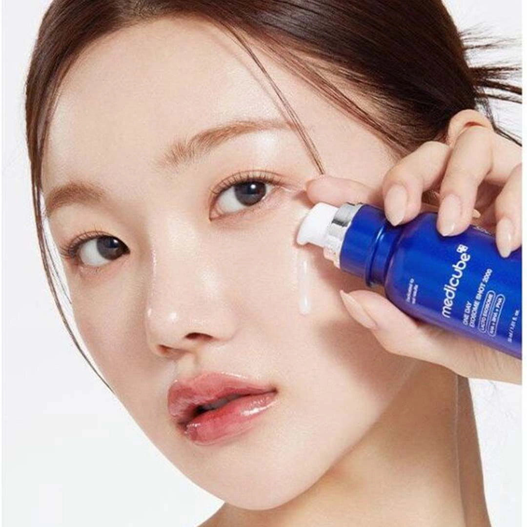 Person applying a blue skincare product to their face
