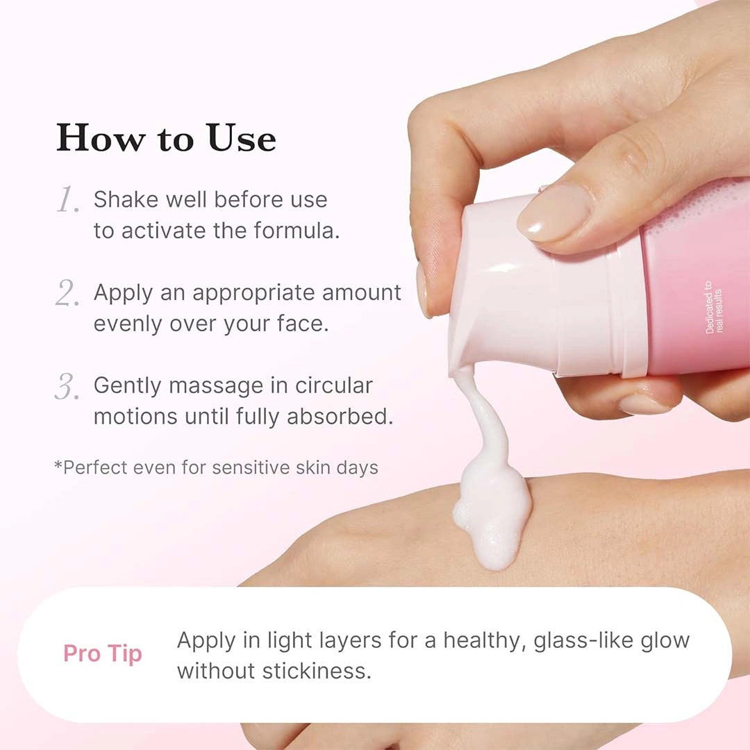 Hand applying pink skincare product with usage instructions on a light pink background