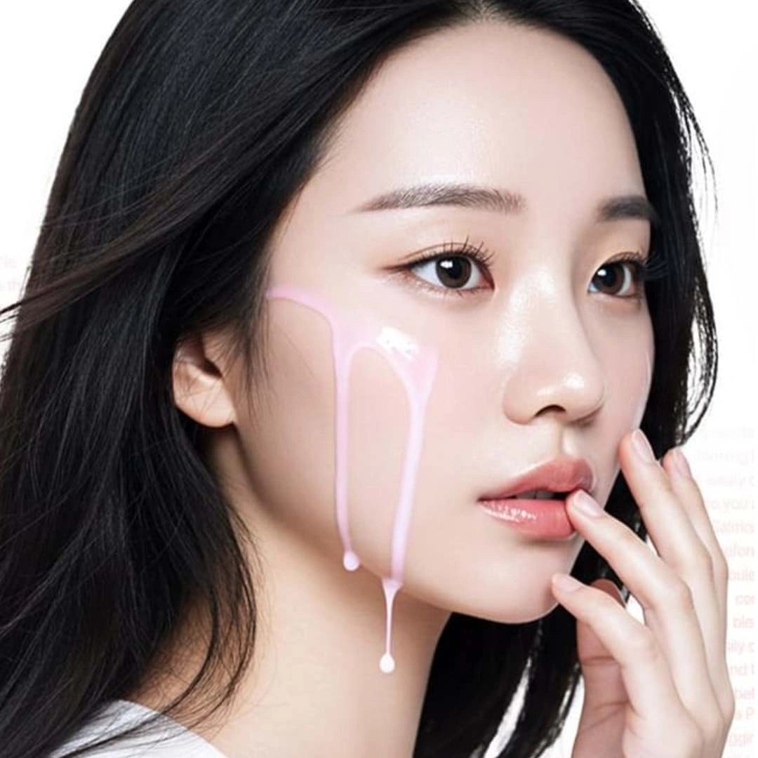 Close-up of a person with a hand near their face on a white background