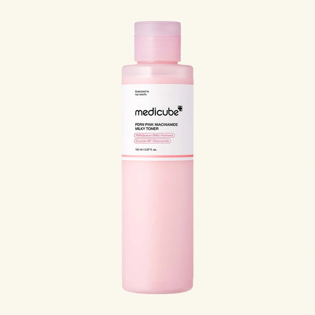 Pink bottle of Medicube toner on a white background