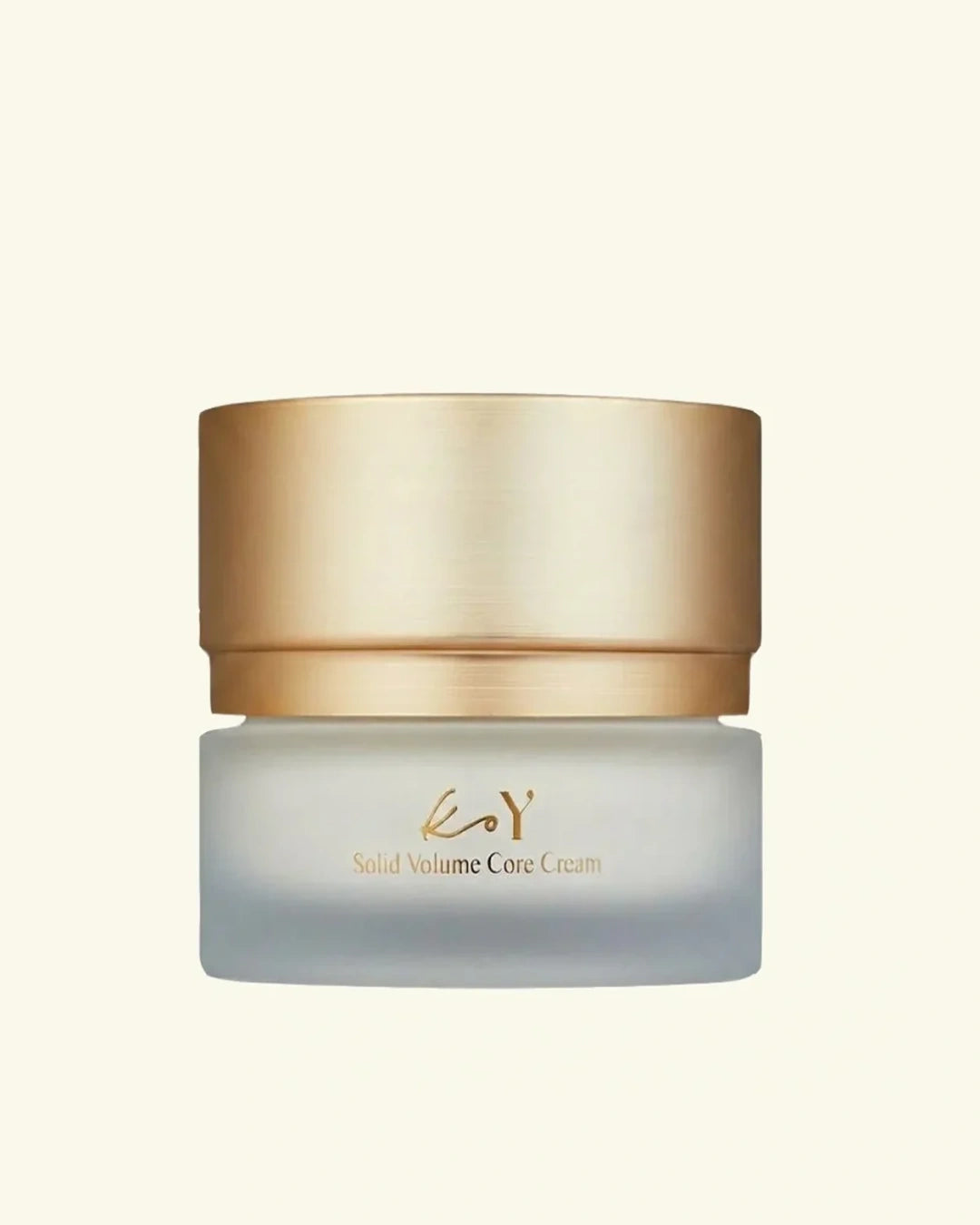 A jar of eyB Solid Volume Core Cream with a metallic gold lid and frosted glass container, centered on a light cream background.