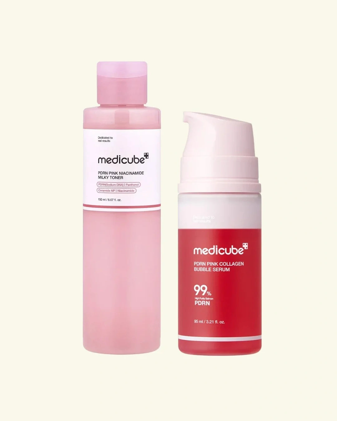 Two Medikube skincare bottles on a light cream background: a pink toner bottle on the left and a red serum pump bottle on the right.