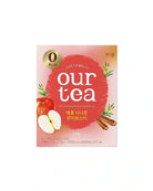 A package of Our Tea Apple Cinnamon Flavored Tea, featuring a pink and red box with illustrations of an apple, cinnamon sticks, and a gold '0 kcal' badge, set against a plain white background.