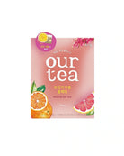 A pink box of Our Tea Fruit Black Tea, featuring illustrations of an orange slice, a grapefruit slice, and pink flowers on a white background.