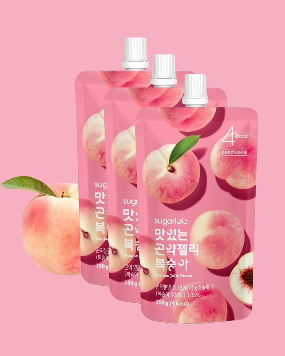 Three pink stand-up pouches of sugar-free peach jelly drink with white caps, shown on a solid pink background with peach illustrations and a whole peach graphic at the lower left.