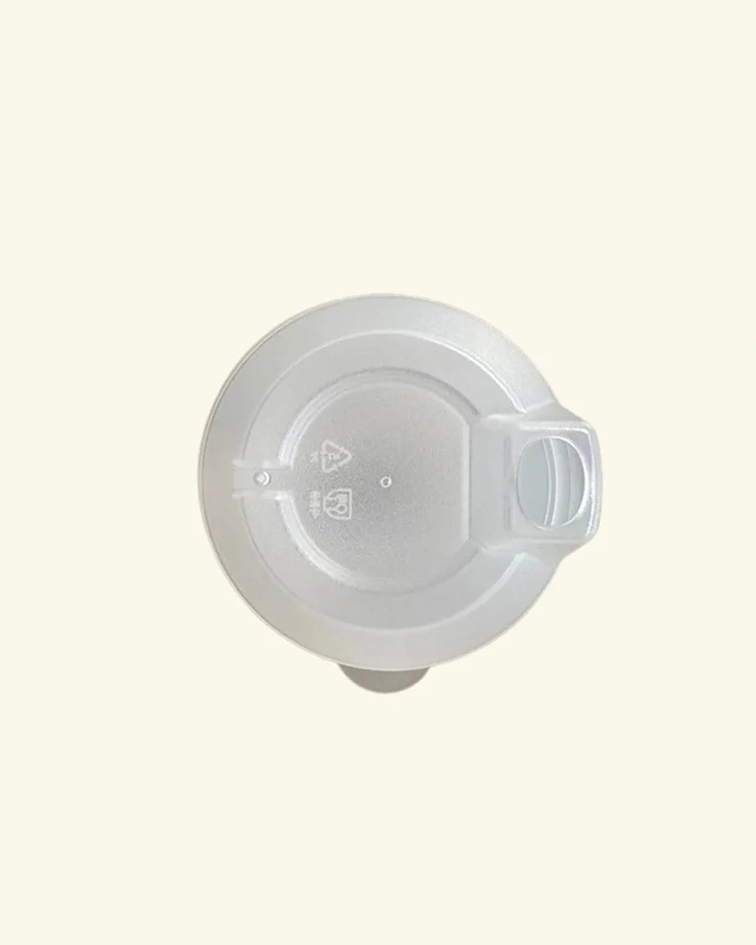 A translucent white plastic lid with a small integrated handle, shown from a top-down view on a solid cream background.