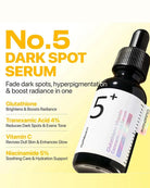 A bottle of Numeniqun No.5 Dark Spot Serum shown on a pale yellow background with promotional text listing key ingredients such as glutathione, tranexamic acid, vitamin C, and niacinamide.