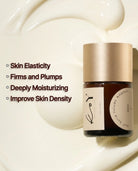 A small cosmetic jar with a metallic gold cap and cream-colored label sits on a glossy white cream background. Text on the left lists benefits: Skin Elasticity, Firms and Plumps, Deeply Moisturizing, Improve Skin Density.