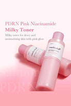 Pink toner bottles with 'medicube' branding on a pink background