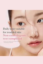 Advertisement for a daily toner suitable for troubled skin with a close-up of a person's face.
