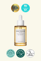 Skincare bottle with dropper labeled 'Hidratac Centella' on a white background, featuring various certification logos.