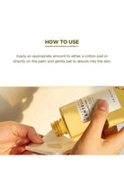 Gold bottle being used to apply a product on a cotton pad with text on how to use.