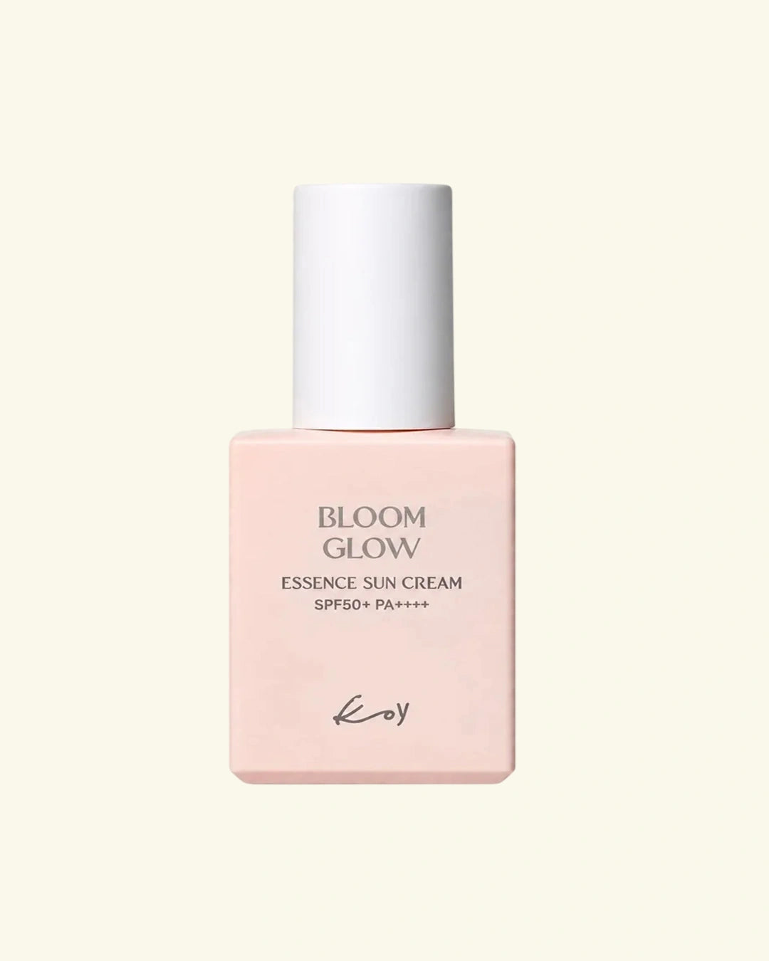 A bottle of Koy Bloom Glow Essence Sun Cream SPF50+ PA+++ in a soft pastel pink bottle with a white cap, centered on a light cream background.
