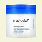 Medicube Zero Pore Pad container with blue lid on a beige background