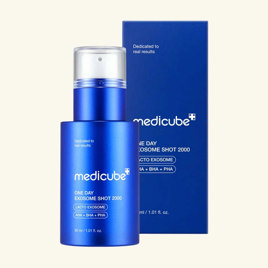Blue Medicube skincare product bottle and packaging on a beige background