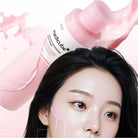 MediCube product with a woman's face in the foreground on a pink background