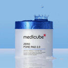 Medicube Zero Pore Pad 2.0 container with water droplets on a blue background