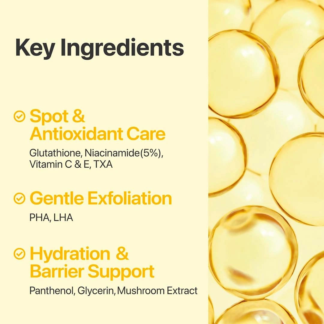 Key ingredients of a skincare product with yellow droplets on a beige background