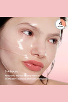 Woman's face with a transparent gel product applied, set against a pink background.
