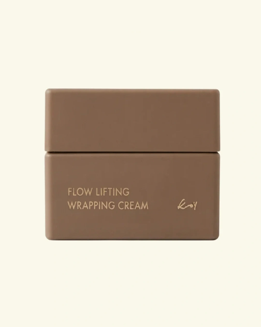 A matte brown cosmetic jar with a matching lid, labeled 'FLOW LIFTING WRAPPING CREAM' in gold lettering, set against a solid cream background.