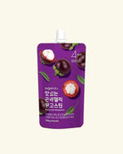 A purple stand-up pouch of sugarlab fruit protein powder featuring camu camu illustrations and Korean text, set against a solid cream background.