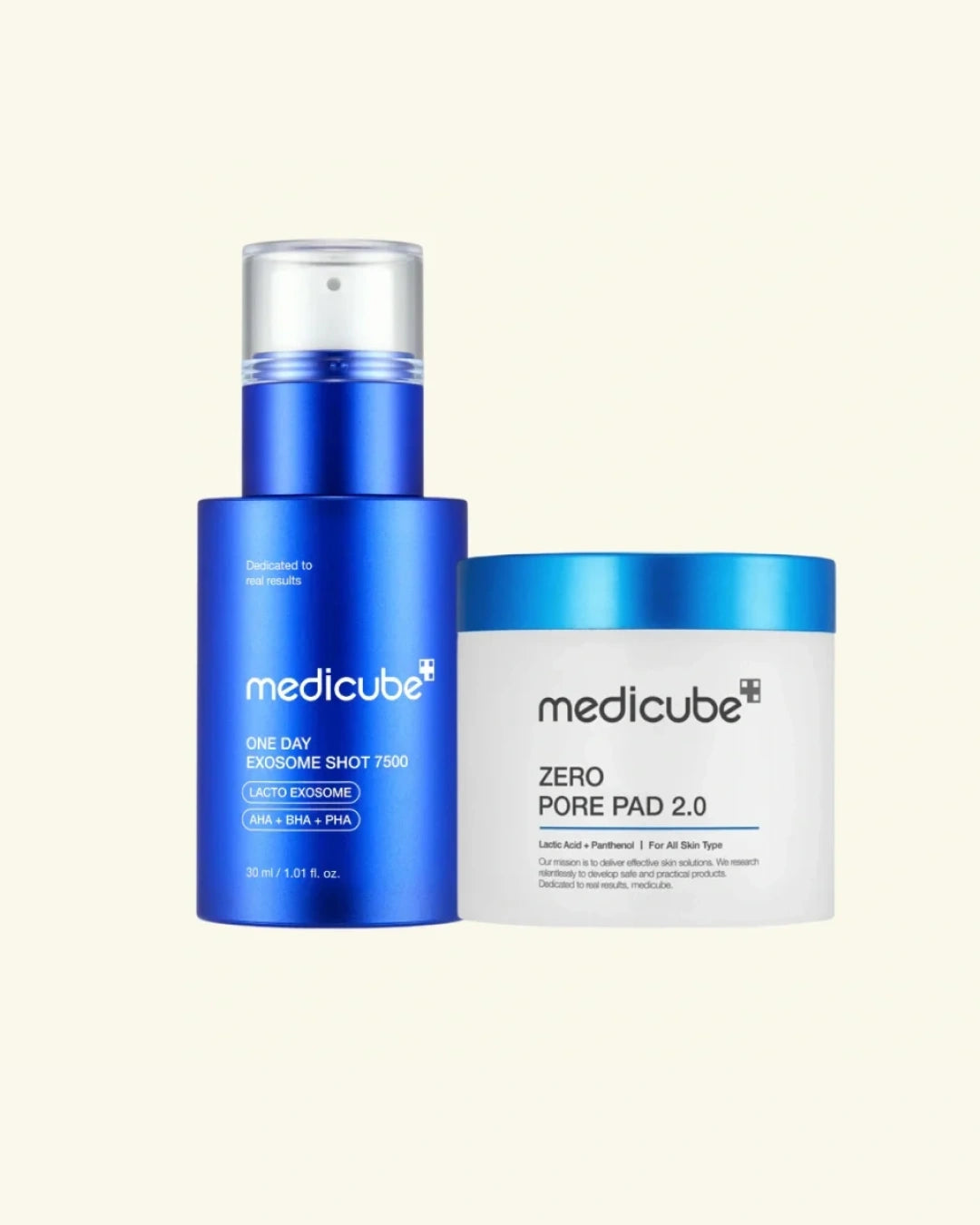 Medicube skincare set featuring a blue one-day enogue shot pump bottle and a white zero pore pad jar with a blue lid, set against a solid cream background.